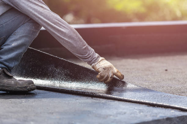 Professional Exterior Waterproofing technician working in Patchogue, NY